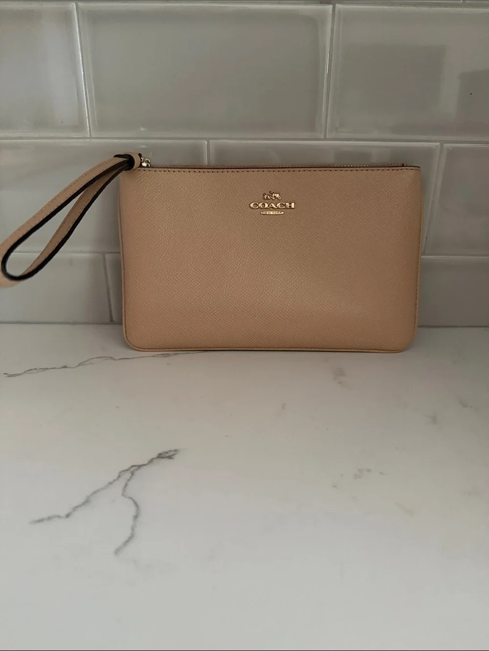 Coach Tan Pebbled Leather Wristlet with Gold Logo